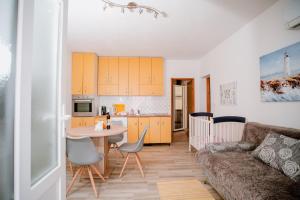 Kuchyň nebo kuchyňský kout v ubytování Apartmens Leona