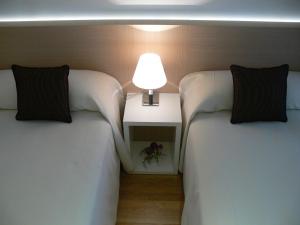 A bed or beds in a room at Center City Flats
