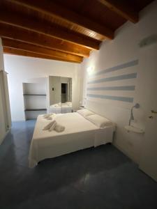 Postel nebo postele na pokoji v ubytování CARUGIO ROOMS Vernazza