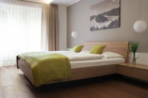 A bed or beds in a room at Gasthof-Pension Schütz