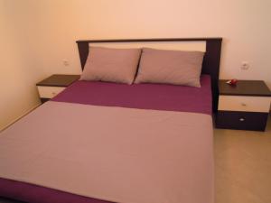 Apartmani Olives tesisinde bir odada yatak veya yataklar