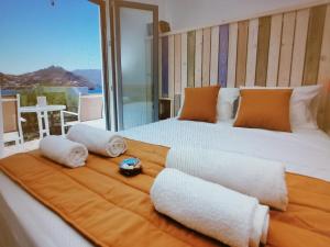 Posteľ alebo postele v izbe v ubytovaní Afrodite Luxury Rooms
