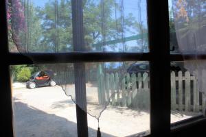a view from a window of a car parked in a driveway at Ellysblue Guesthouse in Pizzo