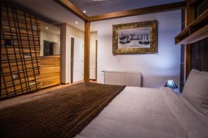 Ένα ή περισσότερα κρεβάτια σε δωμάτιο στο Bentley Apartments