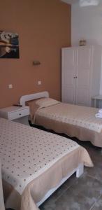 Postel nebo postele na pokoji v ubytování Antonia Rooms