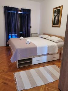 Postel nebo postele na pokoji v ubytování Apartments Valfontane