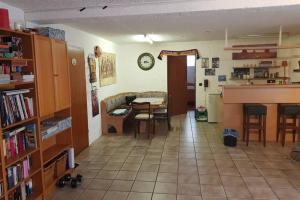 a living room with a table and a kitchen with a counter at Ferienwohnung und Monteurwohnung mit großer begehbarer Dusche in Lünen