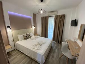 Postel nebo postele na pokoji v ubytování Christina Apartments