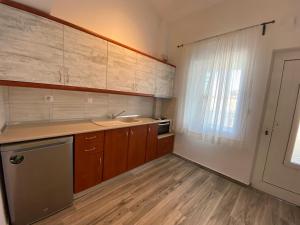 Kuchyň nebo kuchyňský kout v ubytování Christina Apartments + 37 fotografií