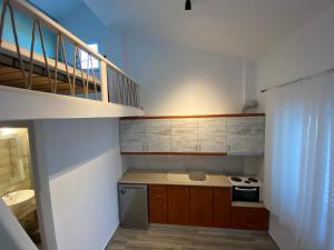 Kuchyň nebo kuchyňský kout v ubytování Christina Apartments