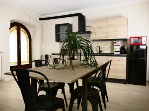 a wooden table with a plant on it in a kitchen at IL NIDO L'Aquila in LʼAquila