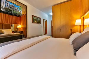 Postel nebo postele na pokoji v ubytování Villa Dvor Kornic