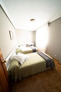 Postel nebo postele na pokoji v ubytování Hotel Isabel