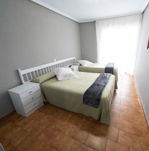 Postel nebo postele na pokoji v ubytování Hotel Isabel