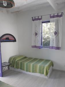 Кровать или кровати в номере Stromboliparadise Piscita