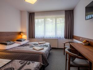 Postel nebo postele na pokoji v ubytování Strama Kościelisko