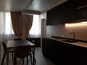 a kitchen with a table and a dining room at Hotel Aquarius Venice - Ascend Collection in Venice