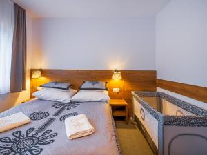 Postel nebo postele na pokoji v ubytování Strama Kościelisko