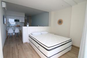 A bed or beds in a room at Lakones Deluxe Suites A