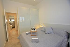 Ein Bett oder Betten in einem Zimmer der Unterkunft Apartman Ivana