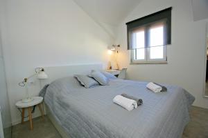 Ein Bett oder Betten in einem Zimmer der Unterkunft Apartman Ivana