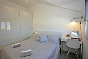 Ein Bett oder Betten in einem Zimmer der Unterkunft Apartman Ivana