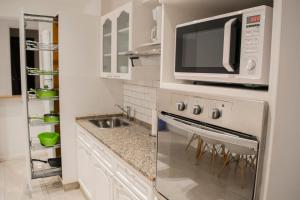 Een keuken of kitchenette bij G&G Apartments - Obelisco Perfect location