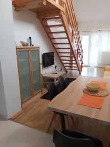 a living room with a wooden table and chairs at Apartment Niko in Vir