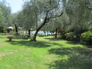 A garden outside Borgo Antico Apartments