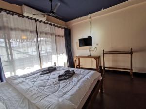 Postel nebo postele na pokoji v ubytování Madera House Chiang Mai