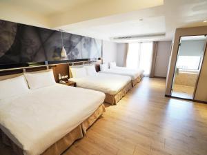 Voodi või voodid majutusasutuse Kailan Hotel toas