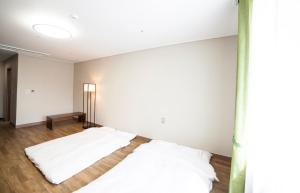 Giường trong phòng chung tại Dongwon Youthhostel