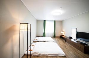Giường trong phòng chung tại Dongwon Youthhostel