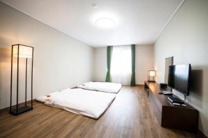 Giường trong phòng chung tại Dongwon Youthhostel