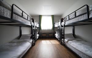 Giường trong phòng chung tại Dongwon Youthhostel