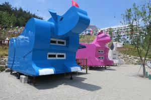 a group of inflatable animals in a park at Dongwon Youthhostel in Tongyeong