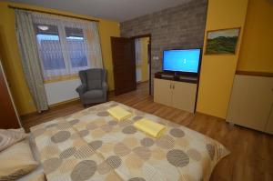 Posteľ alebo postele v izbe v ubytovaní Apartmány Best I. Bešeňová