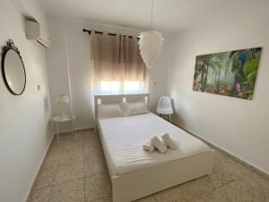 Krevet ili kreveti u jedinici u okviru objekta Orphanides Latchi Apartment