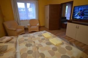 Posteľ alebo postele v izbe v ubytovaní Apartmány Best I. Bešeňová