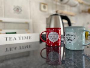 a coffee pot and a mug on a counter at Apartment Audrey - free parking by Irundo in Rijeka +8 photos