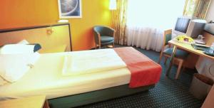 Postel nebo postele na pokoji v ubytování Superior Hotel Präsident