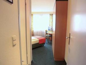 Postel nebo postele na pokoji v ubytování Superior Hotel Präsident