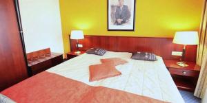 Postel nebo postele na pokoji v ubytování Superior Hotel Präsident