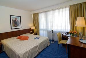 Postel nebo postele na pokoji v ubytování Superior Hotel Präsident