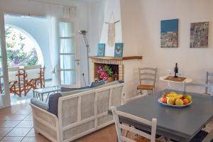 A seating area at Pine Trees and Sea View Houses in Hydra - Daphne, Chloe, Myrto, Eleni