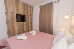 Posteľ alebo postele v izbe v ubytovaní Anius Apartments