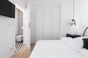 Кровать или кровати в номере Chillax Apartments