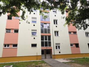 an apartment building with a door at NewIsland Family Apartman in Sárvár