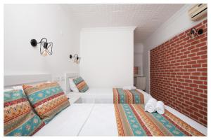 Postel nebo postele na pokoji v ubytování Mavi Yaprak Hotel