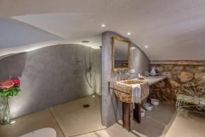 a bathroom with a sink and a mirror at Sa Cabana Vella Fornalutx in Fornalutx +23 photos